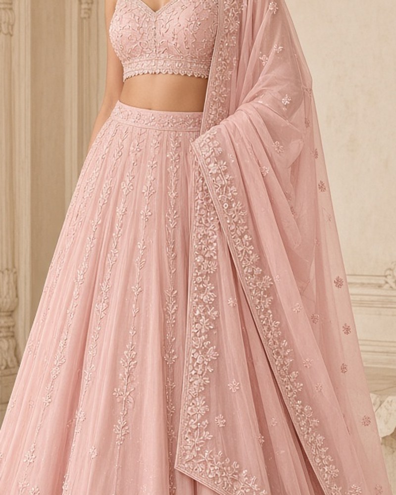 Ruhani Blush Embroidered Lehenga by Ruhani Studio Embroidered lehenga in Blush, available to rent